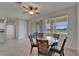 Sunlit dining area features a ceiling fan and views of the outdoors at 2612 Canyon Crest Dr, Lakeland, FL 33811