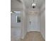Welcoming entryway with tiled floors, a stylish light fixture, and access to the living areas at 2612 Canyon Crest Dr, Lakeland, FL 33811