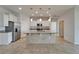 Modern kitchen with white cabinetry, granite countertops, stainless steel appliances, and a large island at 2612 Canyon Crest Dr, Lakeland, FL 33811