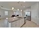 Open kitchen featuring granite countertops, stainless steel appliances, and seamless flow to the living area at 2612 Canyon Crest Dr, Lakeland, FL 33811