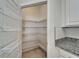 Walk-in pantry with ample shelving for organized storage at 2612 Canyon Crest Dr, Lakeland, FL 33811