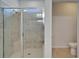 Elegant tiled shower with a glass door at 2612 Canyon Crest Dr, Lakeland, FL 33811