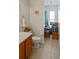 Tiled bathroom with a single vanity, toilet, and walk-in shower at 451 Peace Ct, Kissimmee, FL 34759
