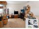 Cozy living room with neutral carpet, lots of storage shelves, and entertainment area at 451 Peace Ct, Kissimmee, FL 34759