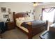 Comfortable main bedroom with ceiling fan, and carpeted floor at 451 Peace Ct, Kissimmee, FL 34759