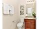 Updated bathroom featuring granite vanity and framed mirror at 5247 Wildwood Way, Davenport, FL 33837