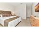 Bedroom featuring neutral tones, carpet flooring and an ensuite bathroom at 5247 Wildwood Way, Davenport, FL 33837