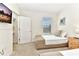 Bedroom featuring two twin beds, neutral colored walls, and closet at 5247 Wildwood Way, Davenport, FL 33837