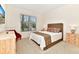 Cozy bedroom with a large window offering natural light and neutral colored walls at 5247 Wildwood Way, Davenport, FL 33837