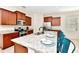 Modern kitchen with stainless steel appliances, granite countertops, and ample cabinetry at 5247 Wildwood Way, Davenport, FL 33837