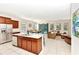 Open-concept kitchen and living area, featuring an island with barstool seating at 5247 Wildwood Way, Davenport, FL 33837