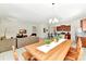 Open concept living area with dining area, a kitchen, and comfortable seating at 5247 Wildwood Way, Davenport, FL 33837