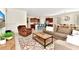 Open living room featuring tile floors, comfortable seating and a colorful area rug at 5247 Wildwood Way, Davenport, FL 33837