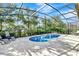 Inviting screened-in pool area with a refreshing pool and lounge chairs for relaxing at 5247 Wildwood Way, Davenport, FL 33837