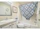 Cozy bathroom with vanity, toilet and bathtub with decorative shower curtain at 9345 Se 171St Le Flore Ln, The Villages, FL 32162