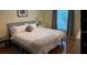 Inviting bedroom with a comfortable bed, soft lighting, and a view of the outdoors through the window at 9345 Se 171St Le Flore Ln, The Villages, FL 32162
