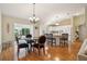 Open floor plan blends dining area with kitchen, with natural light at 9345 Se 171St Le Flore Ln, The Villages, FL 32162