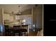 Bright kitchen with white cabinets, stainless steel appliances, and a breakfast bar island at 9345 Se 171St Le Flore Ln, The Villages, FL 32162