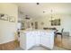Open concept kitchen, offering seating at kitchen island at 9345 Se 171St Le Flore Ln, The Villages, FL 32162