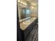 Bathroom featuring a double sink vanity, a large mirror, and modern lighting at 1318 Herschell St, Lakeland, FL 33815