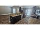 Modern kitchen with stainless steel appliances, dark cabinetry, and stylish countertops at 1318 Herschell St, Lakeland, FL 33815
