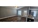 Bright and airy living area with hardwood floors, a kitchen view, and modern finishes at 1318 Herschell St, Lakeland, FL 33815