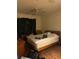 Bedroom view with dresser, bed, and window covered in black plastic at 12849 Madison Pointe Cir # 204, Orlando, FL 32821