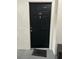 Condo unit 204 features a black painted entrance door with door knocker at 12849 Madison Pointe Cir # 204, Orlando, FL 32821