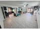 Open basement floor plan with a spiral staircase that provides access to the kitchen and dining room at 2073 Cr 428, Lake Panasoffkee, FL 33538