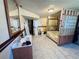 Spacious bathroom featuring modern tile flooring, glass block wall, and vanity with sink at 2073 Cr 428, Lake Panasoffkee, FL 33538