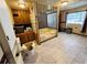 Bright bathroom featuring tiled floor, custom tub, and unique glass block accents at 2073 Cr 428, Lake Panasoffkee, FL 33538