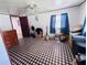 Bedroom with a unique patterned floor, ceiling fan, and natural light from the window at 2073 Cr 428, Lake Panasoffkee, FL 33538