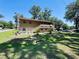 Two-story home with a spacious yard and deck, perfect for outdoor entertaining and enjoying a beautiful sunny day at 2073 Cr 428, Lake Panasoffkee, FL 33538