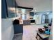 Open-concept kitchen featuring sleek cabinetry, ample countertop space, and modern appliances at 2073 Cr 428, Lake Panasoffkee, FL 33538