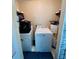 Functional laundry room with washer, dryer, and water heater, maximizing space efficiency at 2073 Cr 428, Lake Panasoffkee, FL 33538