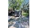 Exterior view of storage shed in backyard, offering ample space for tools and equipment at 2073 Cr 428, Lake Panasoffkee, FL 33538