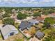 Aerial view of the home in a neighborhood with mature trees and lawns at 181 Osprey Heights Dr, Winter Haven, FL 33880