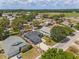 Aerial view of the home with a well-manicured lawn and mature trees at 181 Osprey Heights Dr, Winter Haven, FL 33880