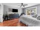Bedroom with laminate flooring, ceiling fan, and comfortable bed at 181 Osprey Heights Dr, Winter Haven, FL 33880