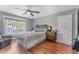 Bedroom featuring laminate floors, neutral colors, and a comfortable king-sized bed at 181 Osprey Heights Dr, Winter Haven, FL 33880