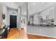 Modern open-concept kitchen with stainless steel appliances, wood-look floors, and a breakfast bar at 181 Osprey Heights Dr, Winter Haven, FL 33880
