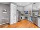 Spacious kitchen with stainless steel appliances, ample storage, and wood laminate flooring at 181 Osprey Heights Dr, Winter Haven, FL 33880