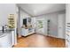 Cozy kitchen featuring white cabinetry, a laminate floors, and breakfast station at 181 Osprey Heights Dr, Winter Haven, FL 33880