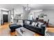 Inviting living area featuring wood laminate flooring, contemporary decor, and abundant natural light at 181 Osprey Heights Dr, Winter Haven, FL 33880