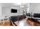 Comfortable seating area featuring wood laminate floors and a media center at 181 Osprey Heights Dr, Winter Haven, FL 33880
