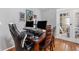 Office area featuring a large desk, multiple monitors, and laminate wood flooring at 181 Osprey Heights Dr, Winter Haven, FL 33880