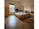 Bright bedroom with a neutral color scheme, tile flooring, and large windows, creating a comfortable space at 1895 Snapper Dr, Kissimmee, FL 34759