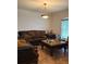 Comfortable living room with tiled floors, large windows, and a traditional chandelier at 1895 Snapper Dr, Kissimmee, FL 34759