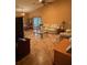Large living room featuring tile flooring, ample natural light and cozy furniture arrangement at 1895 Snapper Dr, Kissimmee, FL 34759