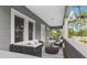 Cozy front porch with stylish seating, creating an inviting outdoor living space at 630 Pear St, Lakeland, FL 33815
